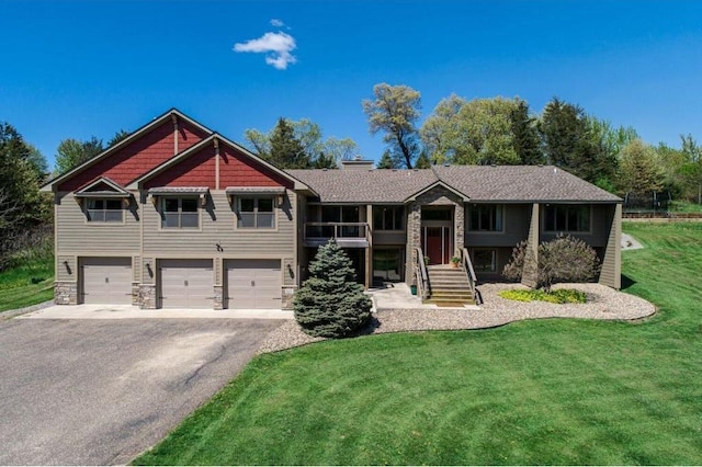 view of front facade featuring a garage and a front lawn