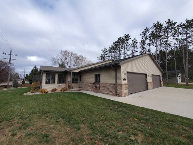 single story home featuring a garage and a front lawn