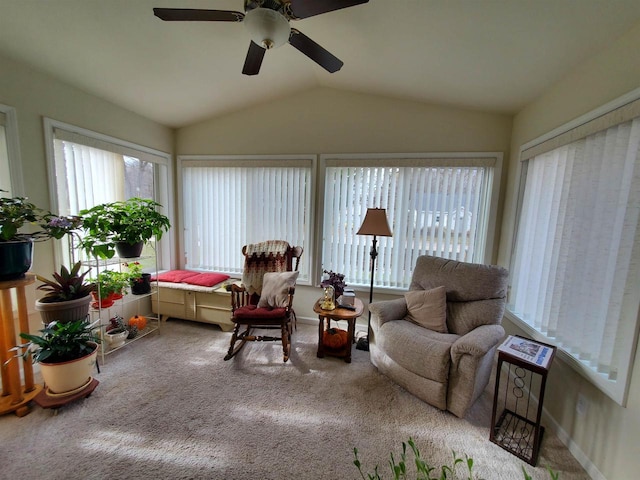 sunroom with ceiling fan and vaulted ceiling