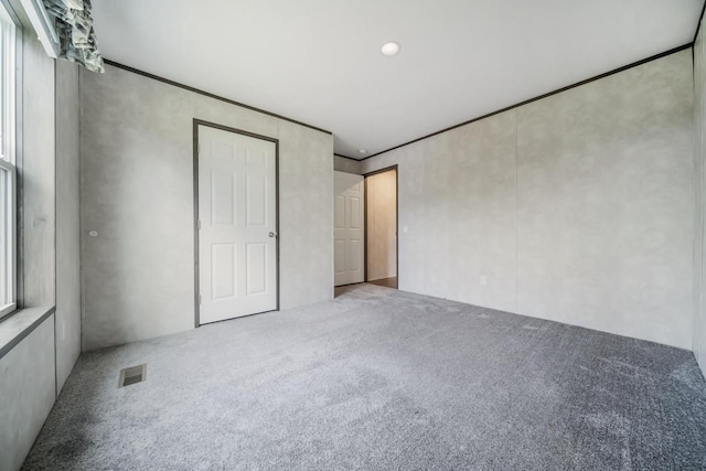 unfurnished bedroom with carpet