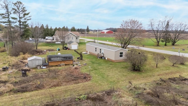 birds eye view of property with a rural view