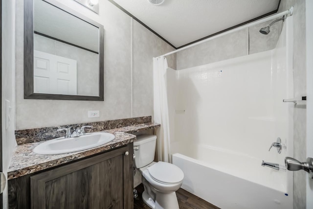 full bathroom with wood-type flooring, a textured ceiling, toilet, shower / tub combo with curtain, and vanity