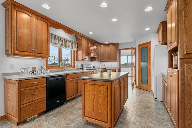 4207 Lost Dauphin Rd, De Pere, WI 54115 - kitchen with black dishwasher, high end stainless steel range, freestanding refrigerator, stone finish floors, and recessed lighting