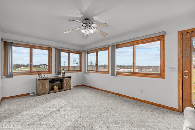 4207 Lost Dauphin Rd, De Pere, WI 54115 - unfurnished living room featuring ceiling fan and light colored carpet