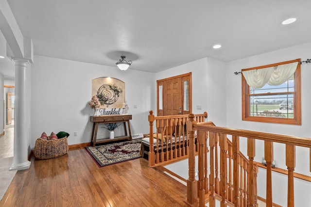 4207 Lost Dauphin Rd, De Pere, WI 54115 - entrance foyer with wood finished floors, recessed lighting, and ornate columns