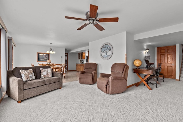 4207 Lost Dauphin Rd, De Pere, WI 54115 - living area with light carpet, a ceiling fan, and a chandelier