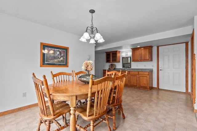 4207 Lost Dauphin Rd, De Pere, WI 54115 - dining area featuring baseboards and a chandelier