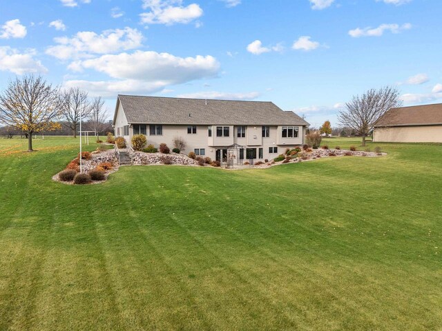 4207 Lost Dauphin Rd, De Pere, WI 54115 - rear view of property featuring a yard
