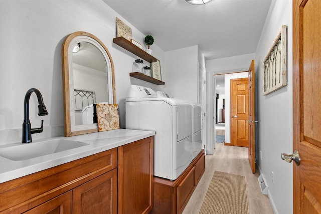 4207 Lost Dauphin Rd, De Pere, WI 54115 - laundry room with washing machine and dryer and light wood finished floors