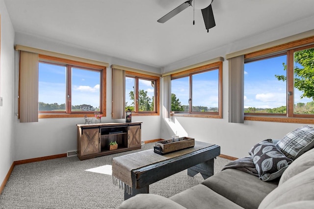 4207 Lost Dauphin Rd, De Pere, WI 54115 - carpeted living room featuring baseboards and ceiling fan