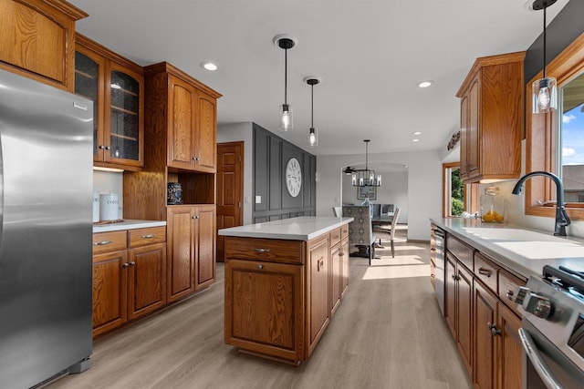 4207 Lost Dauphin Rd, De Pere, WI 54115 - kitchen featuring stainless steel refrigerator, light wood-style flooring, range, brown cabinetry, and recessed lighting