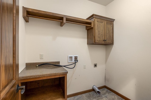 laundry room featuring cabinets, hookup for a washing machine, and electric dryer hookup