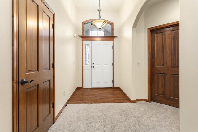 view of carpeted entrance foyer