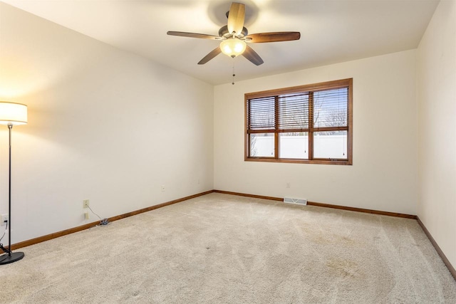 spare room with ceiling fan and carpet floors