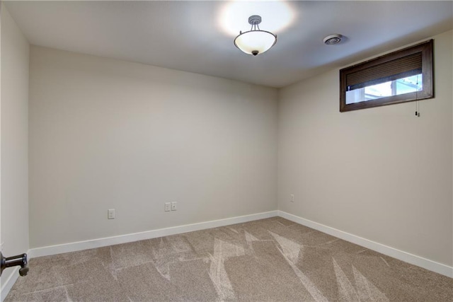 unfurnished room with light colored carpet