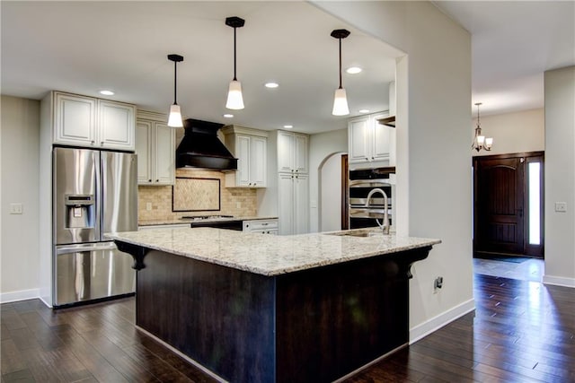 kitchen featuring light stone countertops, stainless steel appliances, dark wood-type flooring, and custom exhaust hood