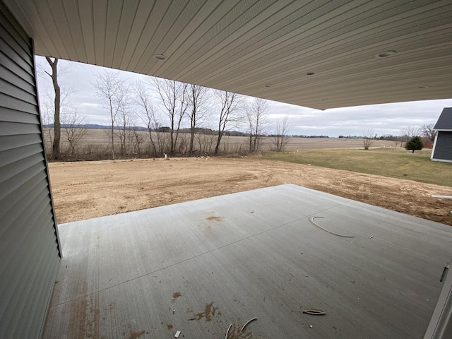 view of patio with a rural view