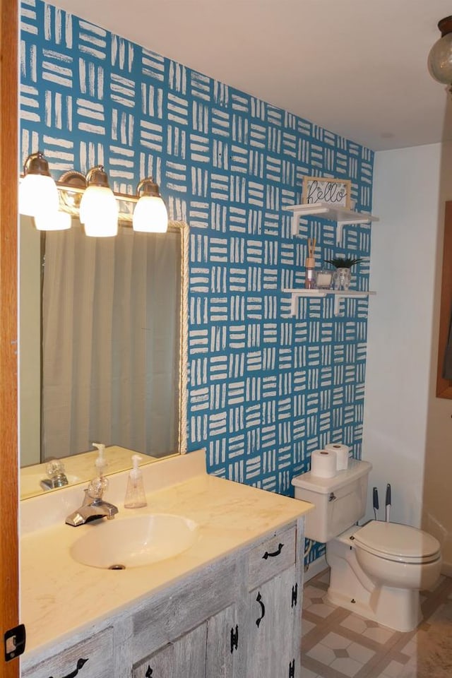 bathroom with vanity and toilet