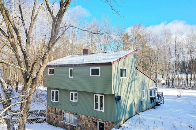 view of snow covered house