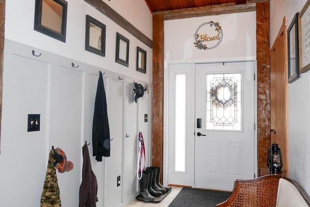 tiled foyer entrance with a healthy amount of sunlight