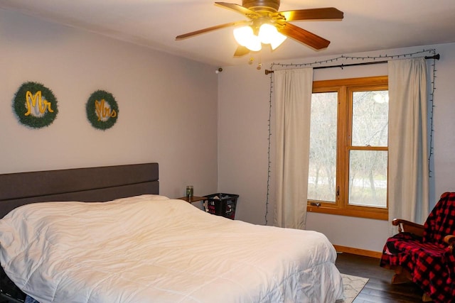 bedroom featuring hardwood / wood-style floors and ceiling fan