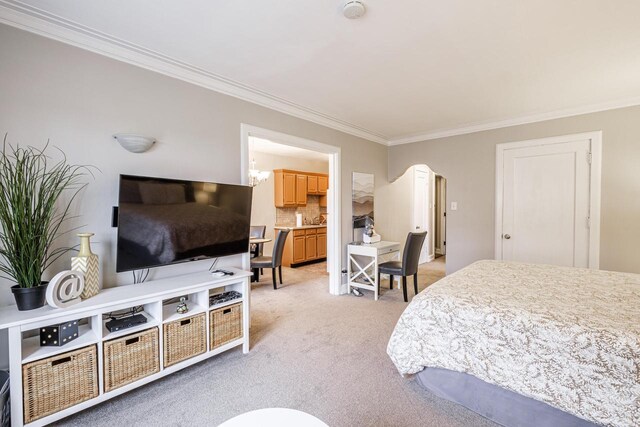 bedroom featuring light carpet and ornamental molding