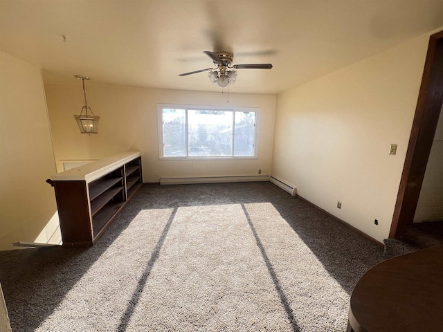 carpeted empty room with ceiling fan and a baseboard heating unit