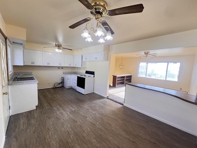 kitchen featuring white cabinetry, sink, dark wood-type flooring, a notable chandelier, and electric stove