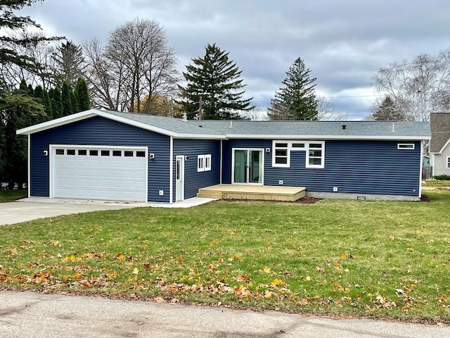 ranch-style home featuring a garage, a wooden deck, and a front lawn