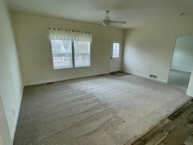 unfurnished room featuring carpet flooring and ceiling fan