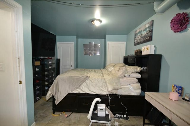 bedroom with light tile patterned floors