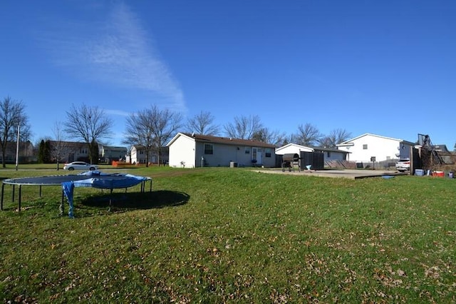 view of yard with a trampoline