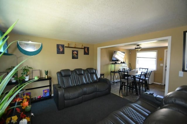 living room with a textured ceiling