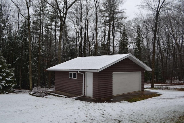 view of snow covered garage