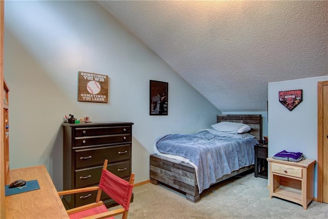 carpeted bedroom with lofted ceiling and a textured ceiling