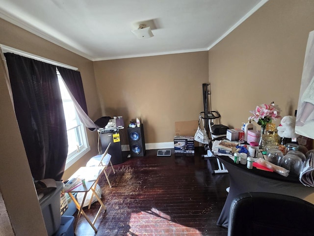 interior space featuring hardwood / wood-style floors and crown molding