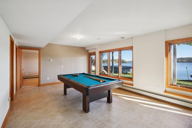 recreation room with a healthy amount of sunlight, a water view, billiards, and a baseboard heating unit