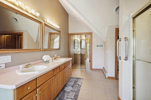 bathroom featuring tile patterned floors, vanity, and a baseboard heating unit