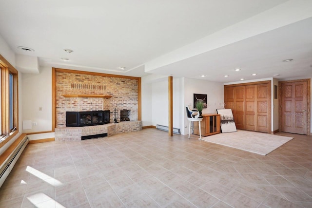 unfurnished living room featuring light tile patterned floors, a brick fireplace, and baseboard heating