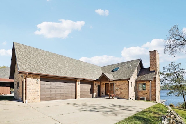 view of front of property featuring a water view and a garage