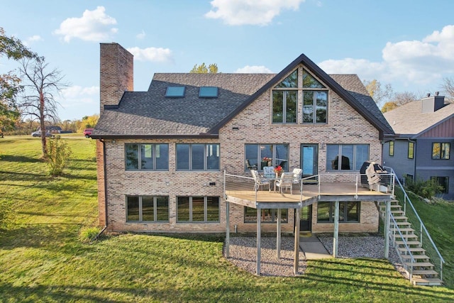 rear view of house featuring a yard and a patio