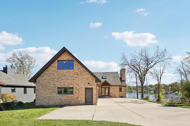 view of front of house featuring a water view and a front yard