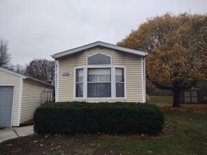 view of side of home with an outbuilding and a garage