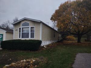 view of home's exterior with a lawn