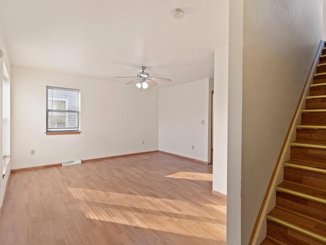 unfurnished room featuring ceiling fan and light wood-type flooring