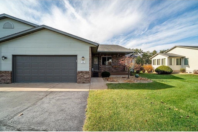 E5745 816th Ave, Colfax, WI 54730 - ranch-style home featuring brick siding, driveway, a garage, and covered porch