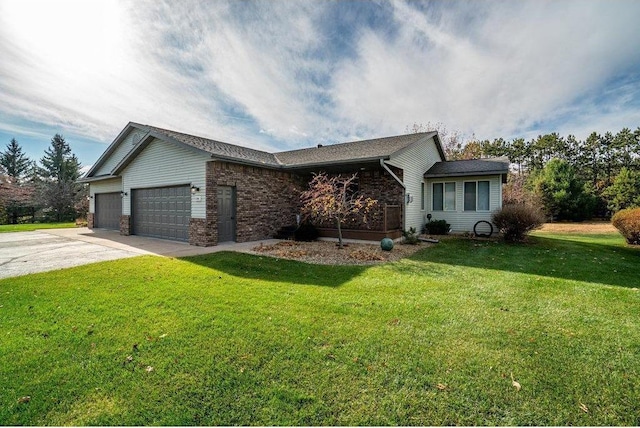 ranch-style home featuring a garage and a front lawn