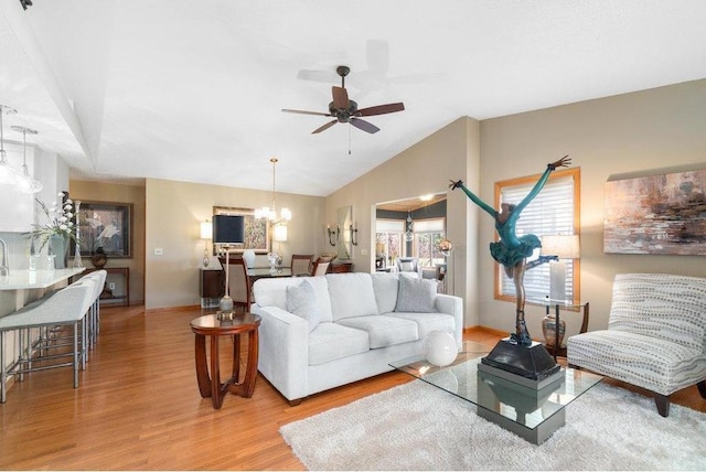 E5745 816th Ave, Colfax, WI 54730 - living room featuring wood finished floors, a chandelier, a ceiling fan, and vaulted ceiling
