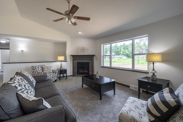 carpeted living room featuring ceiling fan and lofted ceiling