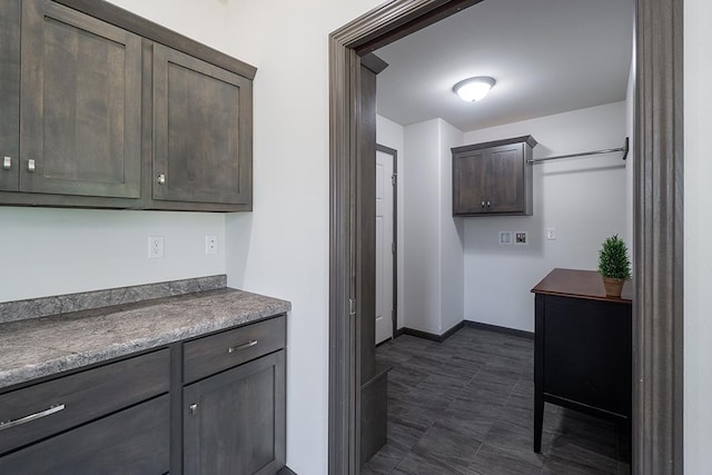 kitchen with dark brown cabinetry